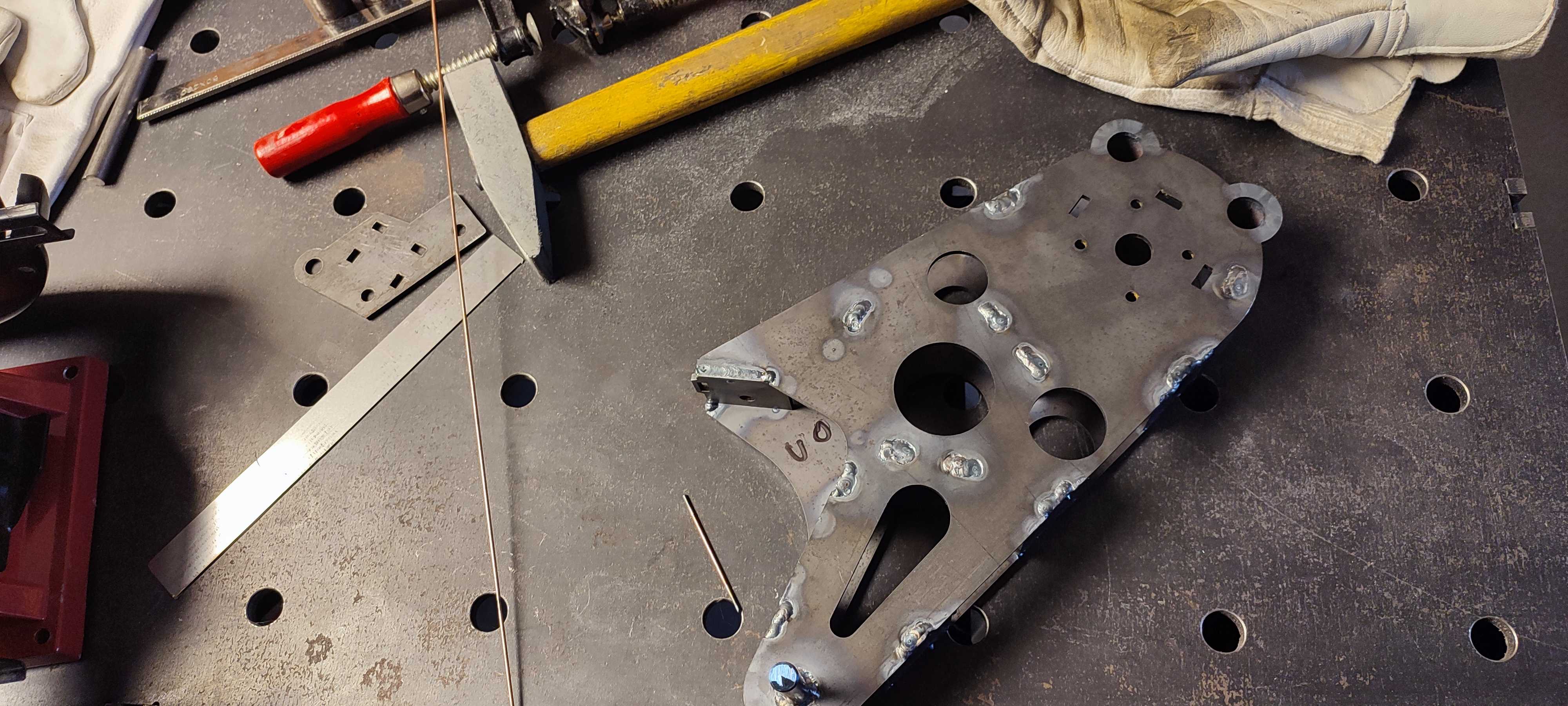 Finished welded motor mount bracket with clean bead work